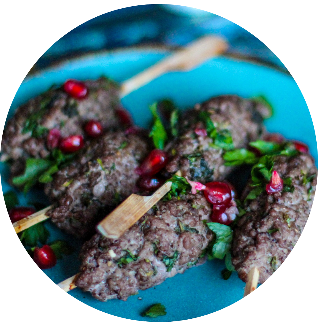 Skewers of grilled lamb on a plate