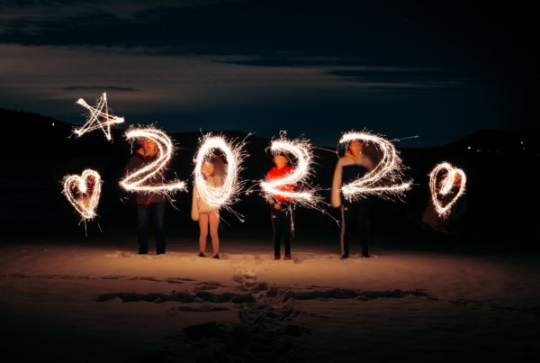 2022 numbers written by sparklers against night sky
