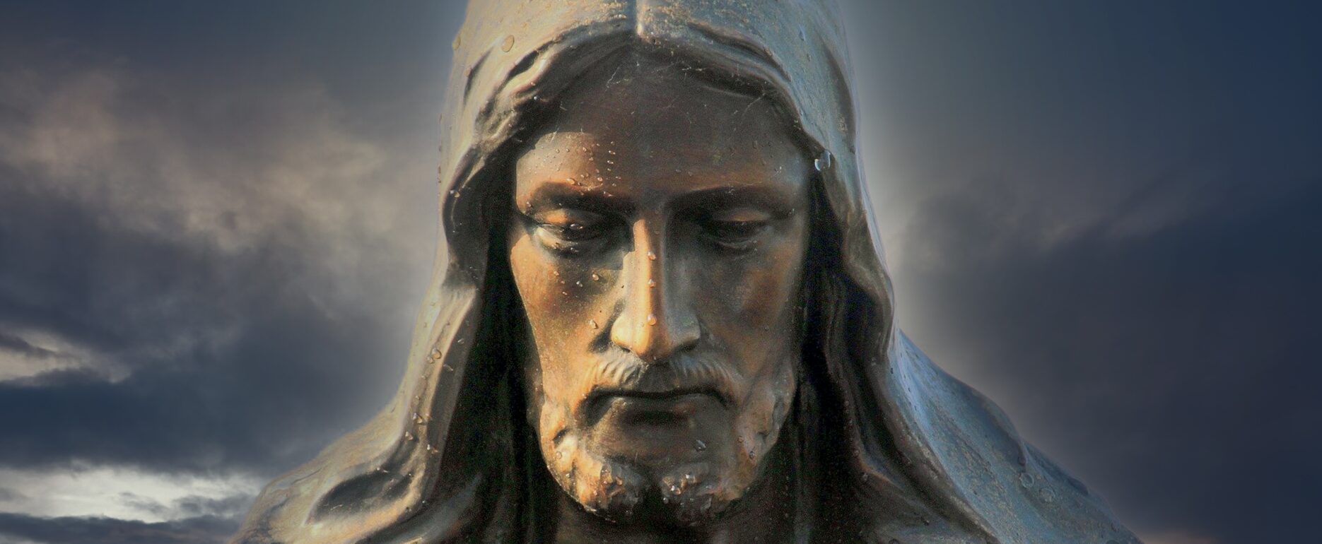 statue of Jesus' face with downward turned face