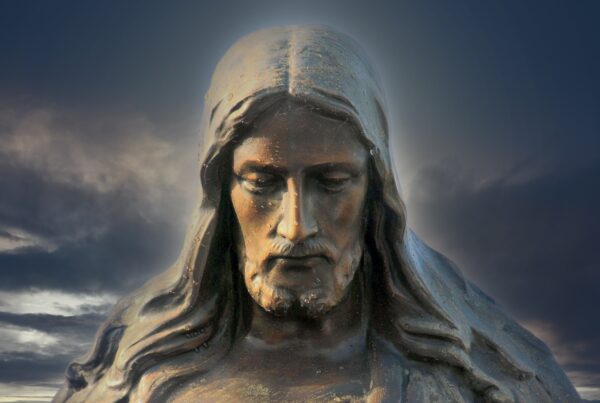statue of Jesus' face with downward turned face