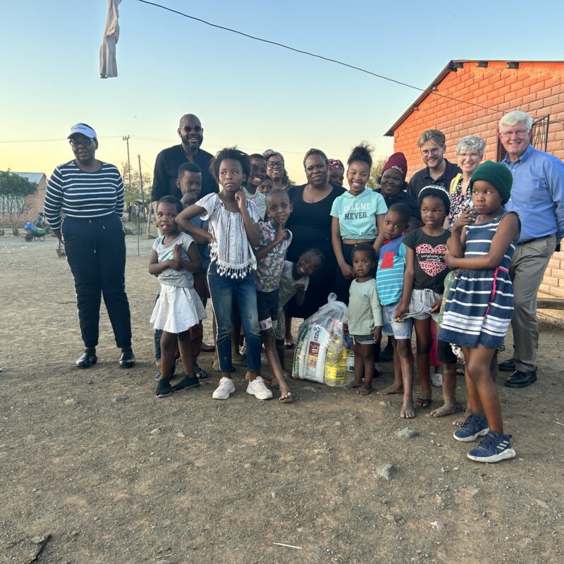 group of a few adults and children outside in South Africa
